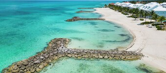 Luxury Beach side escape, steps from private beach, restaurant, marina, and café