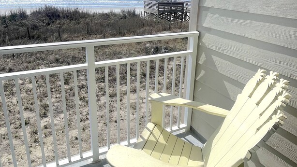 A balcony with a view of the beach and ocean. - Oceanfront ! All linens included ! Stunning view ! 2BR/2BA.  WindJammer Condos (Ocean Isle Beach)