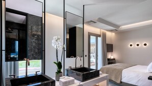 A modern bathroom with two sinks, a large mirror, and a potted orchid. - Remarkable 7-bed Villa in Mikonos - Villa Ataraxia (Mykonos)