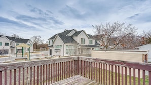 A residential area with houses, a wooden deck, and a green gazebo. - Salt Lake County Home Near 4 Major Ski Resorts! (Midvale)