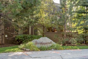 Experience the charm of Bridgepoint, a well-maintained residential setting with a beautiful lawn and paved driveway.