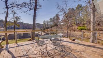 Enjoy the serene views from this deck overlooking the surrounding landscape and body of water.