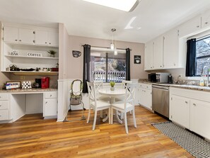 Seating for 4 plus a high chair in the eat-in kitchen.