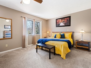 Lower level king suite with wood burning fireplace and SmartTV.