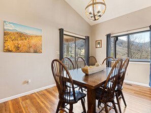 Open concept dining room with fantastic views of the mountains. Seats 8-10.