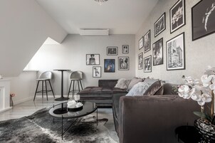 Superior Apartment | Living area | 130-cm flat-screen TV with digital channels, pay movies, heated floors