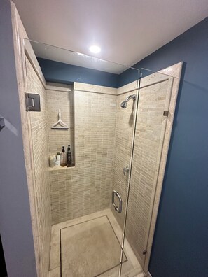 Shower, hair dryer, towels, soap