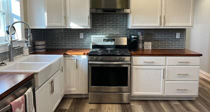Cozy cottage that allows for pets, the experience of outdoors, and the big city!