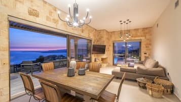 Exclusive Villa | Living area | 50-inch LCD TV with cable channels, fireplace, iPod dock