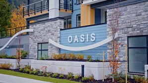 A modern building with a sign that reads "OASIS."