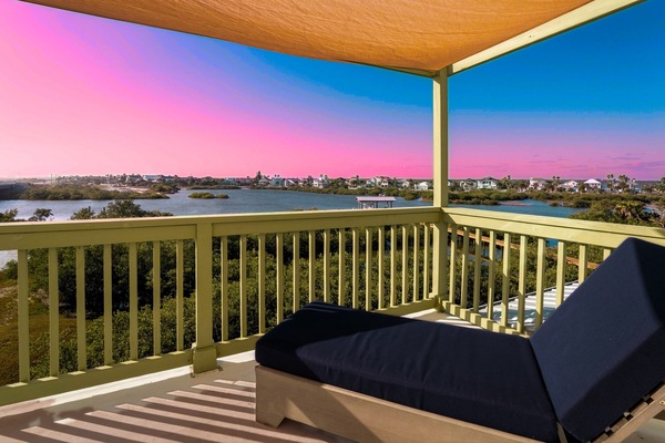 Sun-sail shaded sitting area perfect for morning coffee or evening breezes.