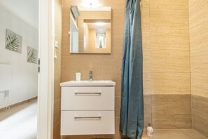 Shower, hair dryer, soap, shampoo