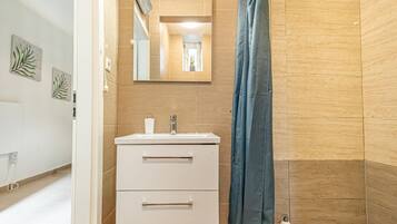 Shower, hair dryer, soap, shampoo