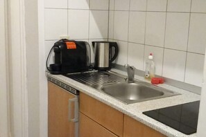 Microwave, stovetop, coffee/tea maker, cookware/dishes/utensils