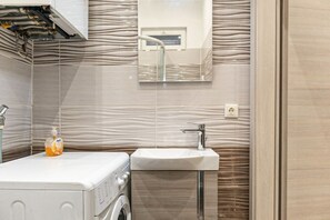 Hair dryer, towels, soap, shampoo