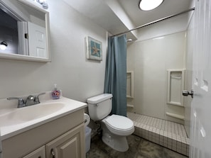 Shower, hair dryer, towels, shampoo