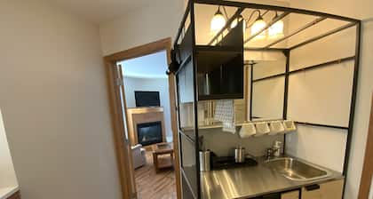 High End King Suite c/w Living room, 2 Fireplaces, 2 Smart TVs, Kitchenette.
