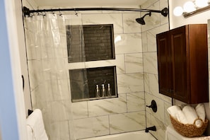 Shower, hair dryer, towels, soap