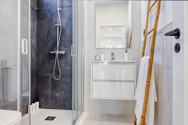 Shower, hair dryer, towels, soap