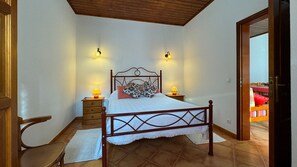 Cozy retreat with a single bed, bedside tables, and lamps.