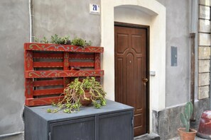 outdoor space with a potted plant and a planter, adjacent to unit 20.