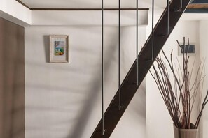 Stunning staircase and modern decor set the tone in this stylish space.