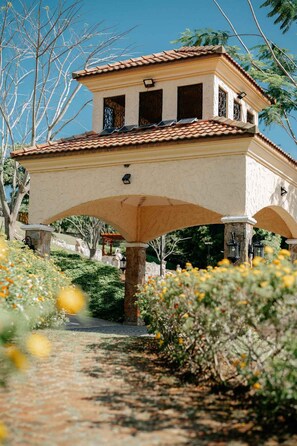 Situated in a serene landscaped garden, this traditional building offers a tranquil retreat.