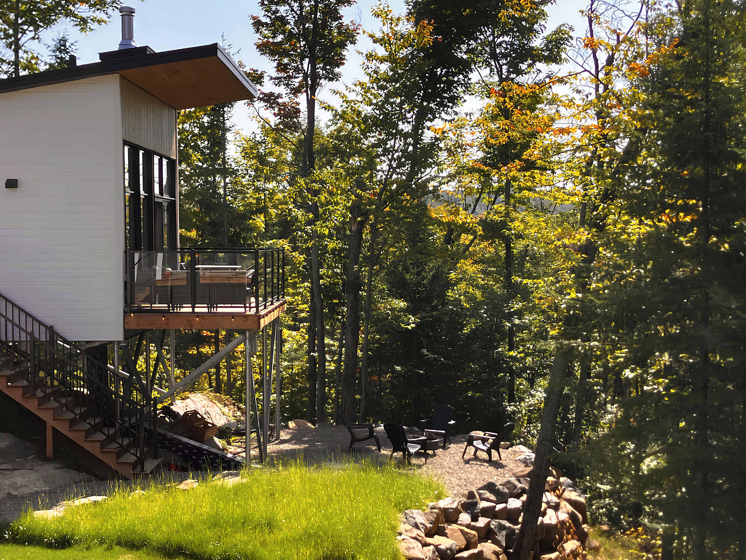 Exterior view of the chalet with a wood-burning outdoor fireplace.
