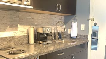 Fridge, microwave, stovetop, coffee/tea maker