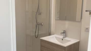 Shower, towels, soap, toilet paper