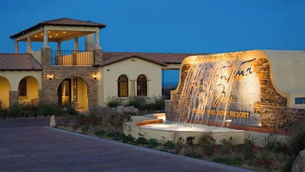 A resort with a stone facade, a covered patio, and a waterfall feature. - Condo 40-4 El Dorado Ranch (San Felipe)
