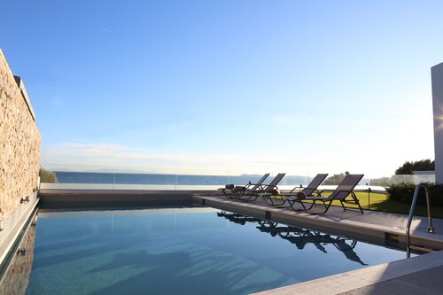 Beach front villa with private sea water pool & amazing sea view to Saronic golf