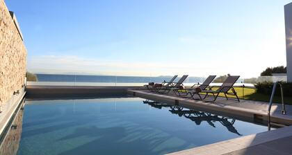 Beach front villa with private sea water pool & amazing sea view to Saronic golf