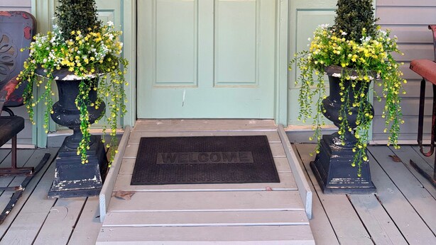 A front door with a wreath, two potted plants, and a welcome mat. - Minutes from Shorter University, Berry College, Tennis Center and Rome Area. (Armuchee)