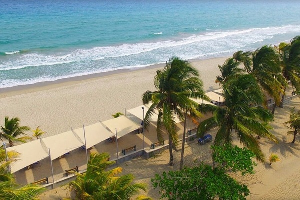 On the beach, white sand, sun loungers, beach towels