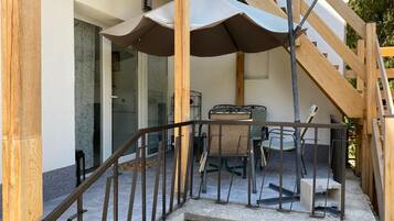 Basic House, 1 Queen Bed with Sofa bed, Patio, Garden View | Terrace/patio