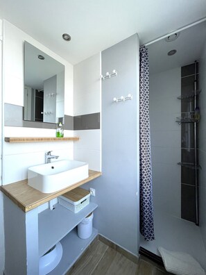 Shower, hair dryer, towels, soap