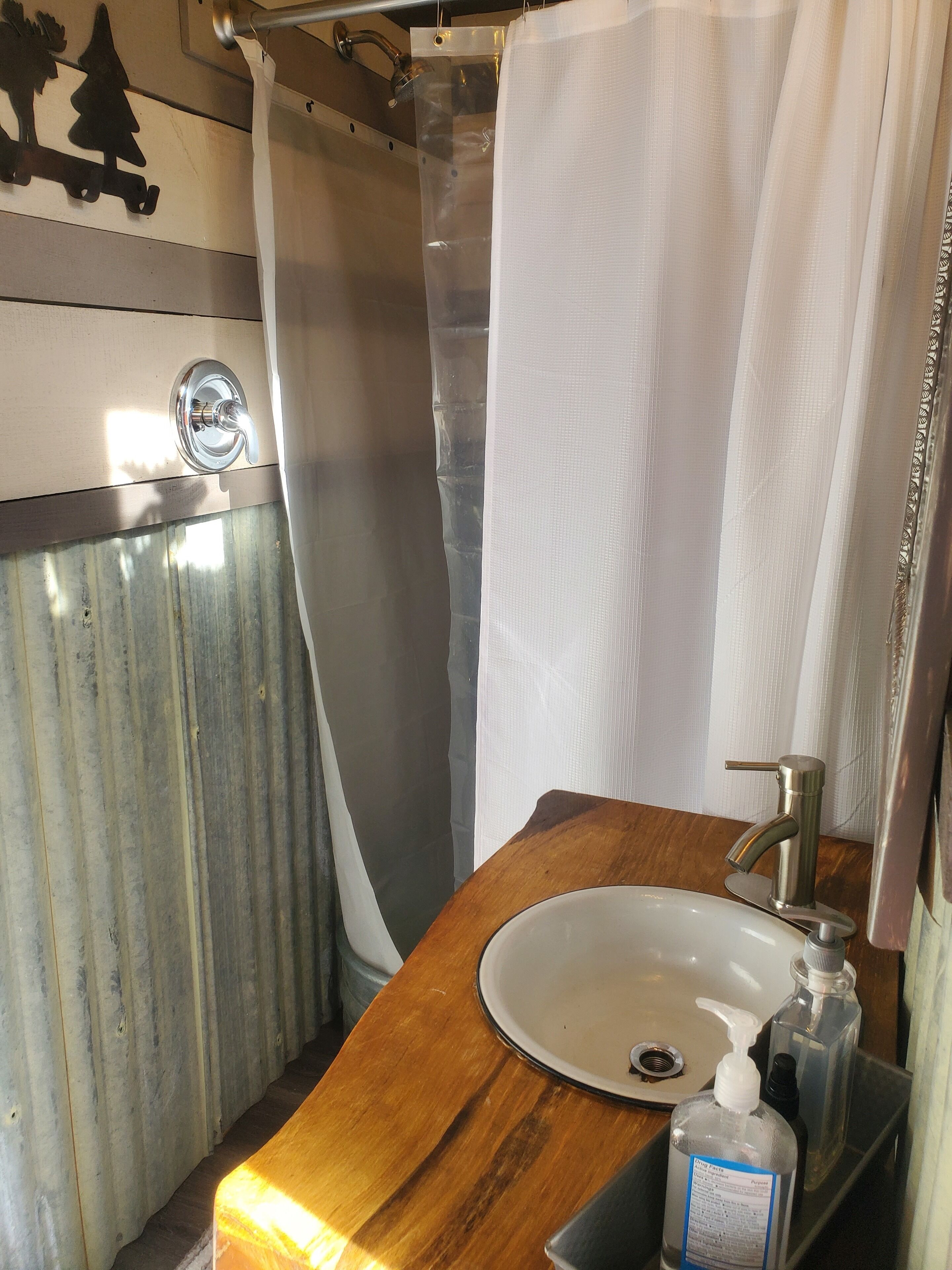 Shower, towels, soap, toilet paper
