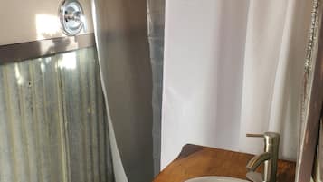 Shower, towels, soap, toilet paper