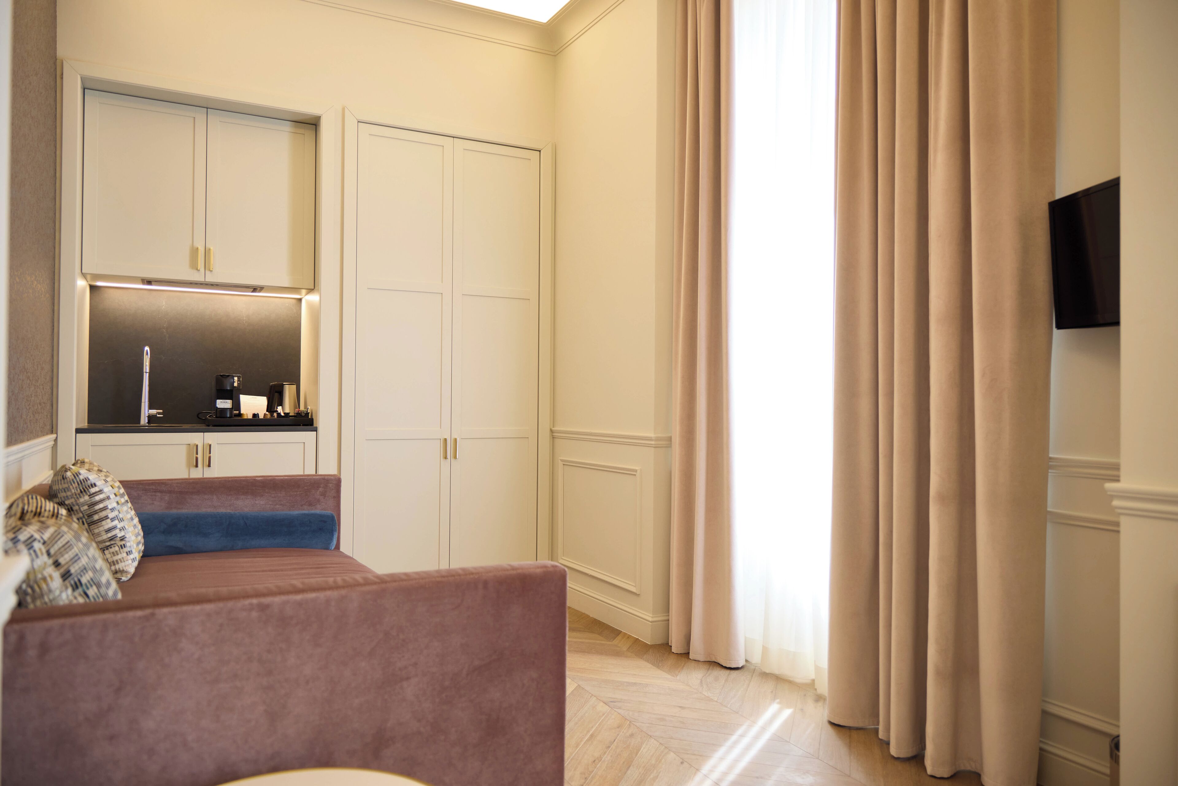 Luxury Studio Suite | Living area | 42-inch Smart TV with digital channels