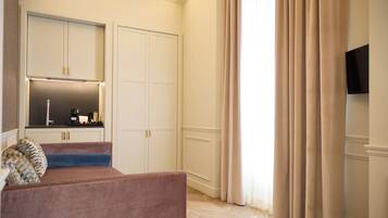 Luxury Studio Suite | Living area | 42-inch Smart TV with digital channels