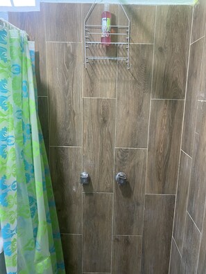 Shower, hair dryer, towels, toilet paper
