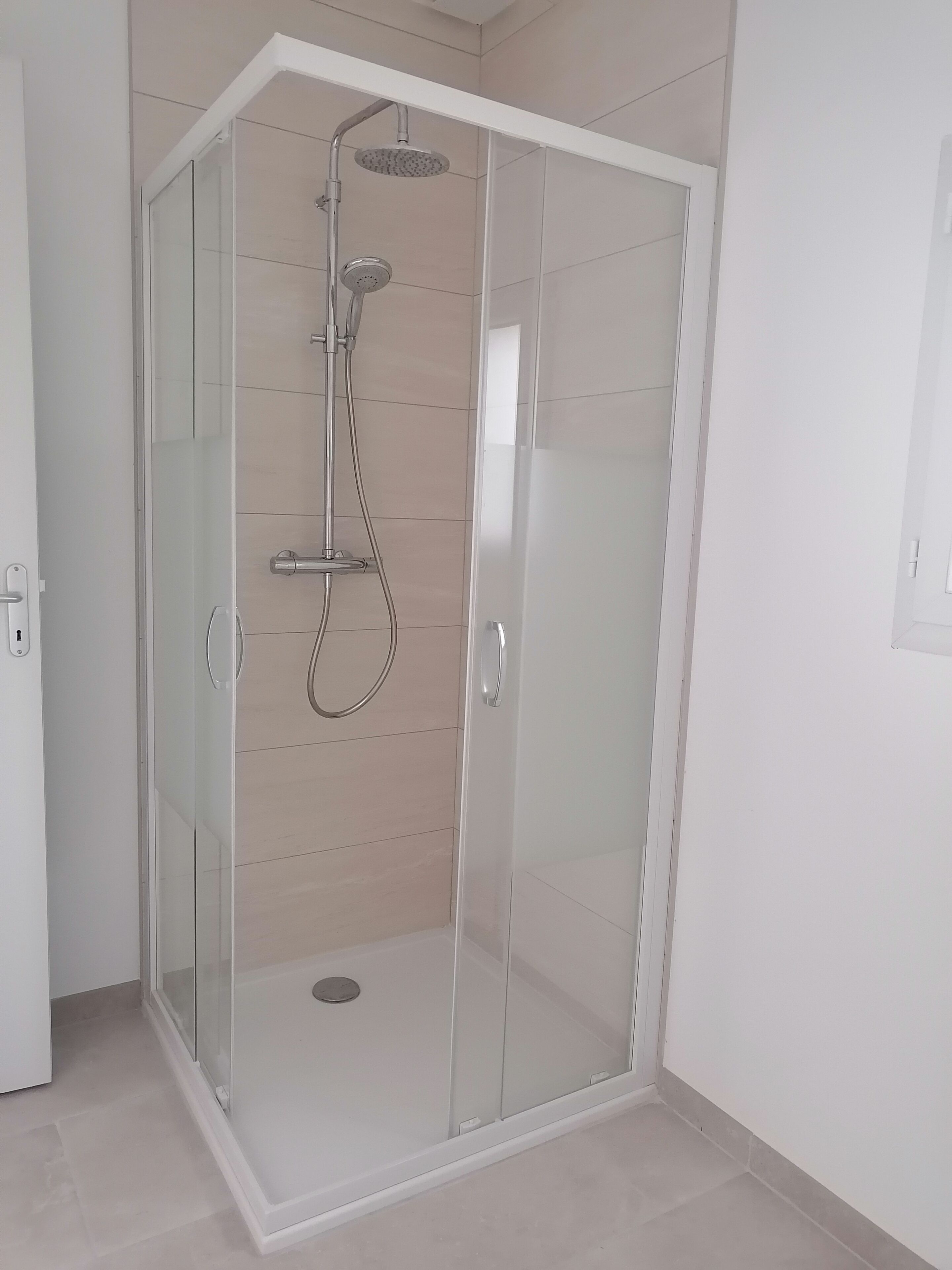 Shower, hair dryer, soap, toilet paper