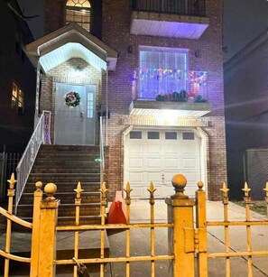 Stylish residential building with a secure entrance and decorative details.