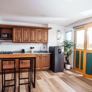 Comfort Apartment | Private kitchen | Full-size fridge, microwave, oven, stovetop
