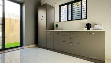 Mini-fridge, electric kettle, cookware/dishes/utensils