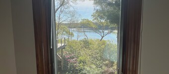 Cozy studio with water views. AC,WiFi, full kitchen, private entrance and patio.