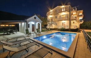 Relax by the pool surrounded by a spacious deck and comfortable seating areas.