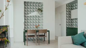 Superior Apartment | Living area | 50-inch Smart TV with premium channels, Netflix, streaming services