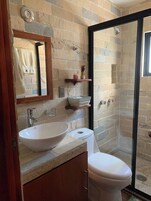 Combined shower/bathtub, deep-soaking bathtub, designer toiletries